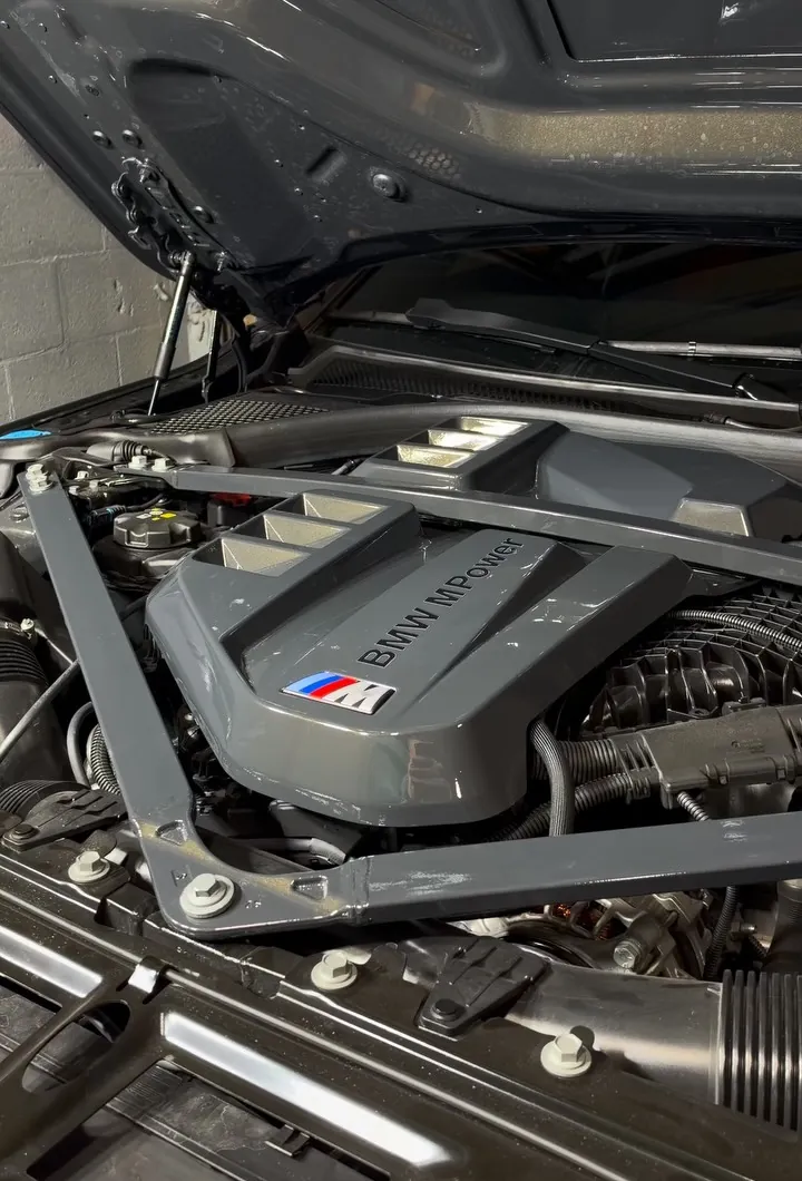 BMW M3 Competition engine bay with the engine cover and strut brace painted Dravit Grey